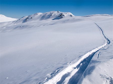 simsearch:400-09079917,k - Deep skiing tracks in the snow on the alps in Austria Stockbilder - Microstock & Abonnement, Bildnummer: 400-07213126