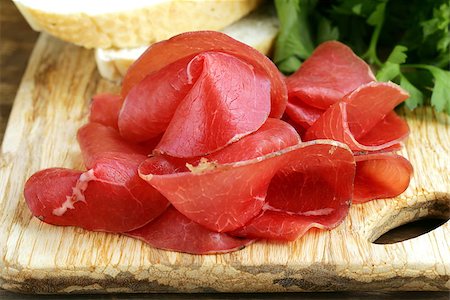 simsearch:400-07481817,k - Smoked meat bresaola on a cutting board Stock Photo - Budget Royalty-Free & Subscription, Code: 400-07213415