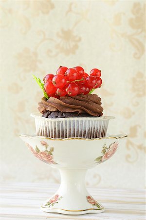 Chocolate cupcake with red currant in the romantic scenery Stock Photo - Budget Royalty-Free & Subscription, Code: 400-07213420