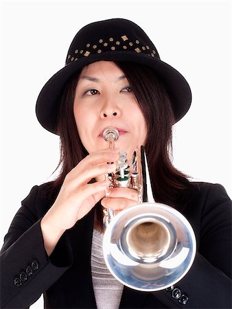 Portrait of a Female Trumpet Player - Isolated on White Stock Photo - Budget Royalty-Free & Subscription, Code: 400-07213718