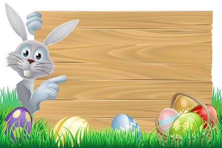 White Easter rabbit bunny pointing at a sign, with chocolate Easter eggs and basket Stock Photo - Budget Royalty-Free & Subscription, Code: 400-07224126