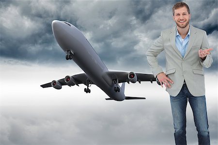 flying gesture with hands - Composite image of stylish man smiling and gesturing with hand up Stock Photo - Budget Royalty-Free & Subscription, Code: 400-07224505