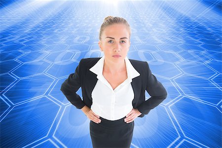 simsearch:400-07224720,k - Composite image of blonde businesswoman standing with hands on hips Stock Photo - Budget Royalty-Free & Subscription, Code: 400-07224664