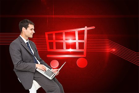 Composite image of businessman using laptop sitting on chair Stock Photo - Budget Royalty-Free & Subscription, Code: 400-07224719