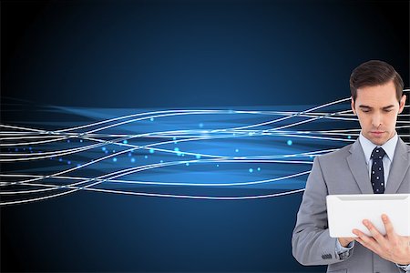 simsearch:400-07225597,k - Composite image of businessman holding a tablet computer Stock Photo - Budget Royalty-Free & Subscription, Code: 400-07224808