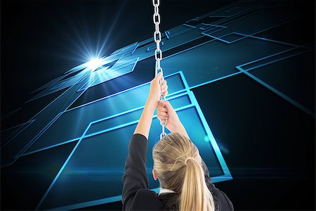 simsearch:400-07224720,k - Composite image of blonde businesswoman pulling a chain Stock Photo - Budget Royalty-Free & Subscription, Code: 400-07224872