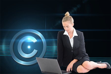 Composite image of blonde businesswoman using laptop Stock Photo - Budget Royalty-Free & Subscription, Code: 400-07225108