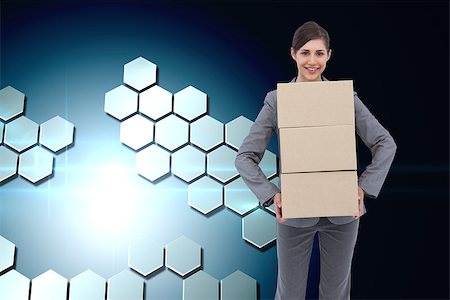 Composite image of smiling businesswoman carrying cardboard boxes Stock Photo - Budget Royalty-Free & Subscription, Code: 400-07225231