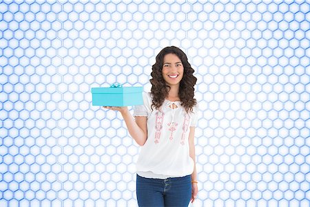 simsearch:400-07189587,k - Composite image of content casual brunette holding a present Stockbilder - Microstock & Abonnement, Bildnummer: 400-07225262