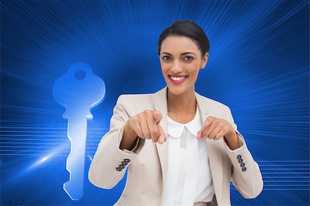 simsearch:400-07227450,k - Composite image of smiling businesswoman pointing at the camera Stock Photo - Budget Royalty-Free & Subscription, Code: 400-07225318