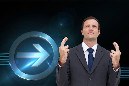 simsearch:400-07258010,k - Composite image of serious businessman with fingers crossed is looking up Foto de stock - Royalty-Free Super Valor e Assinatura, Número: 400-07225380