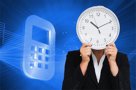 futuristic clock - Composite image of businesswoman in suit holding a clock Stock Photo - Budget Royalty-Free & Subscription, Code: 400-07225418
