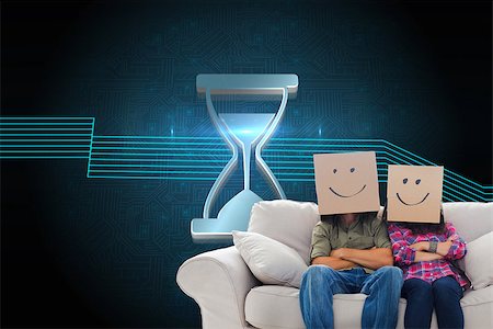 Composite image of silly employees with arms folded wearing boxes on their heads with smiley faces on a couch Stock Photo - Budget Royalty-Free & Subscription, Code: 400-07225496
