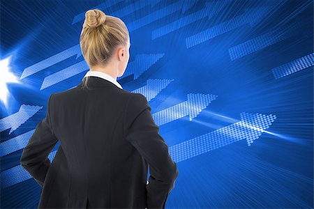 simsearch:400-07258010,k - Composite image of blonde businesswoman standing with hands on hips Foto de stock - Royalty-Free Super Valor e Assinatura, Número: 400-07225804