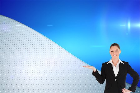 Composite image of charming woman in suit showing a copy space while standing Foto de stock - Super Valor sin royalties y Suscripción, Código: 400-07226352