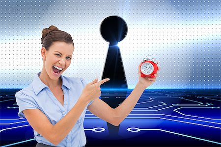 simsearch:400-07225597,k - Composite image of businesswoman indicating alarm clock with finger Stock Photo - Budget Royalty-Free & Subscription, Code: 400-07226632