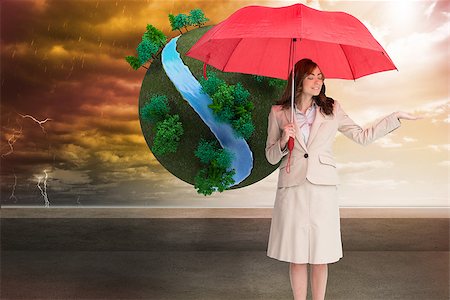female business woman holding ball - Composite image of attractive businesswoman holding red umbrella Stock Photo - Budget Royalty-Free & Subscription, Code: 400-07227120