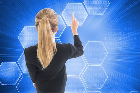 simsearch:400-07224720,k - Composite image of blonde businesswoman pointing somewhere Stock Photo - Budget Royalty-Free & Subscription, Code: 400-07227203
