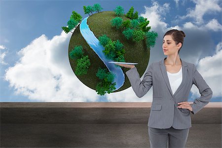 female business woman holding ball - Composite image of businesswoman holding tablet computer Stock Photo - Budget Royalty-Free & Subscription, Code: 400-07227308