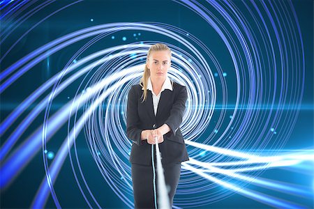 simsearch:400-07224720,k - Composite image of blonde businesswoman pulling a rope Stock Photo - Budget Royalty-Free & Subscription, Code: 400-07227820
