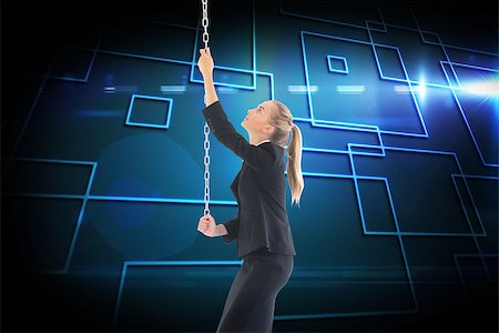 simsearch:400-07224720,k - Composite image of blonde businesswoman pulling a chain Stock Photo - Budget Royalty-Free & Subscription, Code: 400-07227859