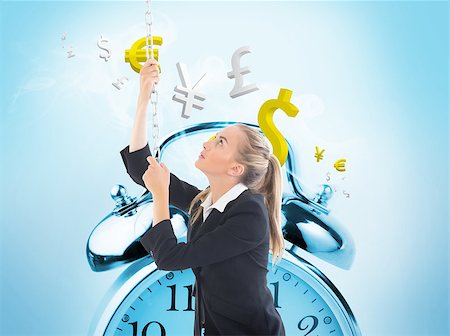 simsearch:400-06876570,k - Composite image of blonde businesswoman pulling a chain Stock Photo - Budget Royalty-Free & Subscription, Code: 400-07220220