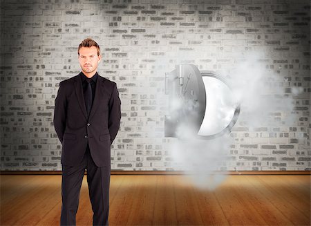 smoking room - Composite image of young businessman looking seriously at the camera Stock Photo - Budget Royalty-Free & Subscription, Code: 400-07220546