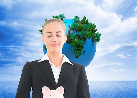 female business woman holding ball - Composite image of blonde businesswoman holding piggy bank Stock Photo - Budget Royalty-Free & Subscription, Code: 400-07220737