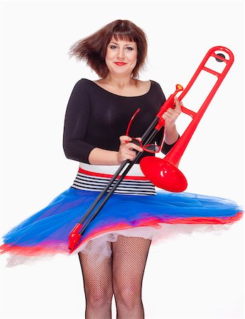Young Female Musician with Red Trombone Dancing - Isolated on White Photographie de stock - Aubaine LD & Abonnement, Code: 400-07220835