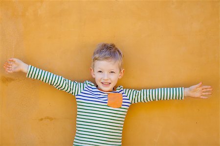 simsearch:400-07545937,k - portrait of positive smiling boy holding his hands wide Stock Photo - Budget Royalty-Free & Subscription, Code: 400-07220873