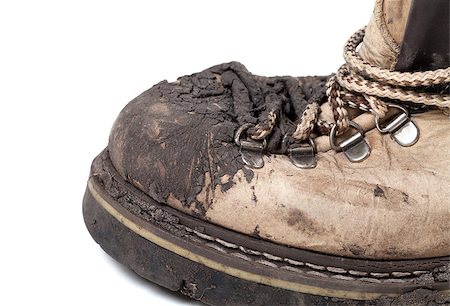 extreme terrain - Old dirty trekking boot isolated on white background. Close-up view. Foto de stock - Super Valor sin royalties y Suscripción, Código: 400-07221334