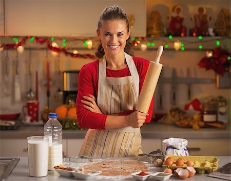 eggs milk - Portrait of smiling young housewife with rolling pin Stock Photo - Budget Royalty-Free & Subscription, Code: 400-07221448