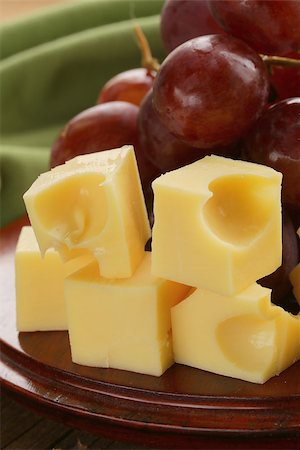 simsearch:400-05682309,k - wooden plate with cheese (Maasdam) and red grapes Stock Photo - Budget Royalty-Free & Subscription, Code: 400-07221760