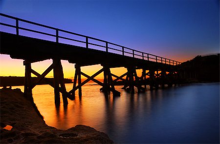 simsearch:400-07667033,k - Silhouetted pier bridge to Bare Island Botany Bay Auistralia Stock Photo - Budget Royalty-Free & Subscription, Code: 400-07221794