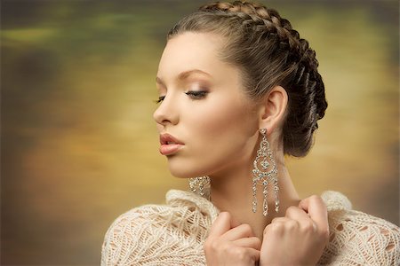 fashion close-up portrait of elegant female posing with classic hair-style, precious earrings and wool shawl Stock Photo - Budget Royalty-Free & Subscription, Code: 400-07221949