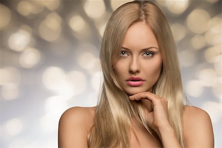 salon background - portrait of sensual young woman with naked shoulders, perfect skin and splendid blonde smooth hair Stock Photo - Budget Royalty-Free & Subscription, Code: 400-07222210