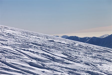 simsearch:400-08780271,k - Ski slope with trace from ski and snowboards in newly - fallen snow. Georgia, ski resort Gudauri. Caucasus Mountains. Photographie de stock - Aubaine LD & Abonnement, Code: 400-07222340