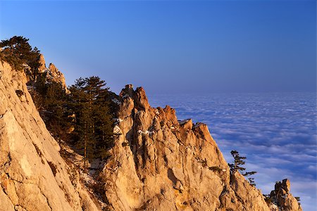 Sunlit rocks and sea in clouds at evening. Crimean mountains in winter, Ukraine. Stock Photo - Budget Royalty-Free & Subscription, Code: 400-07222356