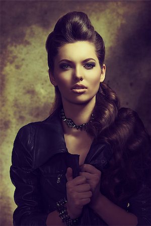 fashion portrait of sexy modern woman with long brown wavy creative hair-style, dark rock style wearing leather jacket Stock Photo - Budget Royalty-Free & Subscription, Code: 400-07223208