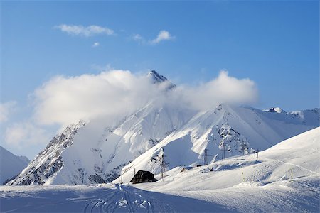 simsearch:400-07222348,k - Snow skiing piste at evening. Caucasus Mountains. Georgia, ski resort Gudauri Fotografie stock - Microstock e Abbonamento, Codice: 400-07223260