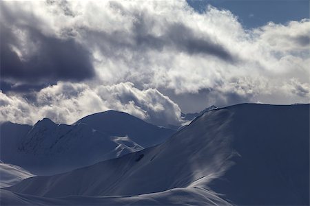simsearch:400-07211845,k - Off piste slope in sunlight clouds at evening. Ski resort Gudauri. Caucasus Mountains, Georgia. Stockbilder - Microstock & Abonnement, Bildnummer: 400-07223273