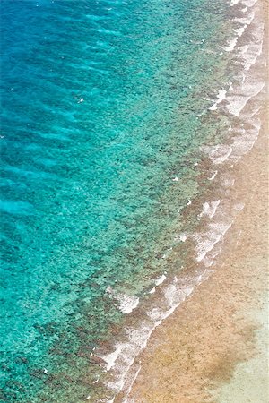 aerial view of the barrier reef of the coast of San Pedro, Belize. with large waves breaking away from the coast Stock Photo - Budget Royalty-Free & Subscription, Code: 400-07223756