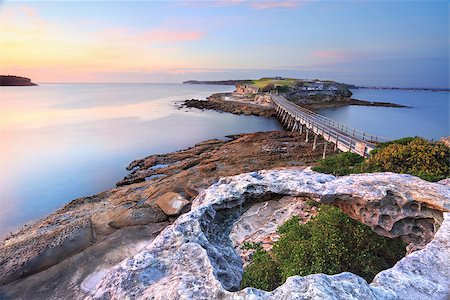 simsearch:400-07667033,k - Bare Island Australia, view from La Perouse, Sydney bathed in pretty pastel pink and yellow light at sunrise on a calm summers morning. Focus to foreground. Stock Photo - Budget Royalty-Free & Subscription, Code: 400-07223794