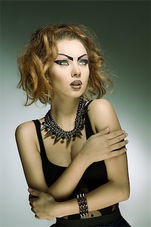 simsearch:400-07223828,k - fashion portrait of modern dark punk lady with bizarre purple make-up, black sexy dress and studs accessories Fotografie stock - Microstock e Abbonamento, Codice: 400-07223833