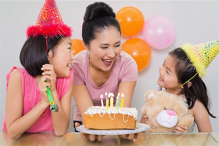 east asian ethnicity girl cake - Close-up of cute little girls looking at mother with cake at a birthday party Stock Photo - Budget Royalty-Free & Subscription, Code: 400-07230134