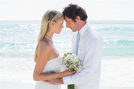 simsearch:400-07664797,k - Loving couple on their wedding day at the beach Stock Photo - Budget Royalty-Free & Subscription, Code: 400-07231511