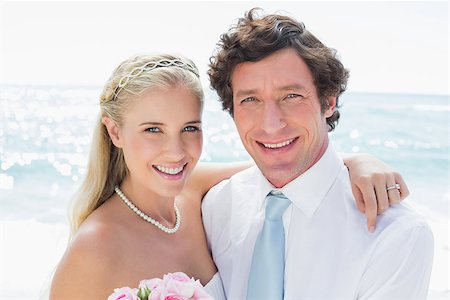 simsearch:400-07664797,k - Cute cheerful couple on their wedding day at the beach Stock Photo - Budget Royalty-Free & Subscription, Code: 400-07231522