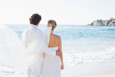 simsearch:400-07664797,k - Newlyweds looking out to the sea together at the beach Stock Photo - Budget Royalty-Free & Subscription, Code: 400-07231540