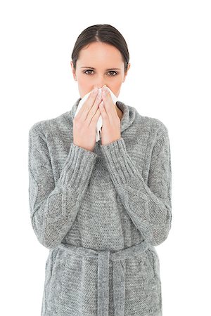 simsearch:400-06868935,k - Portrait of a casual young woman suffering from cold over white background Foto de stock - Super Valor sin royalties y Suscripción, Código: 400-07231631