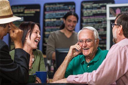 Mature people in a coffee house laughing Stock Photo - Budget Royalty-Free & Subscription, Code: 400-07244044